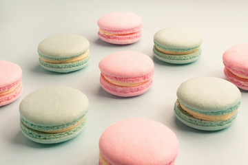 Fototapeta na wymiar Close-up of green and pink color sweet macarons