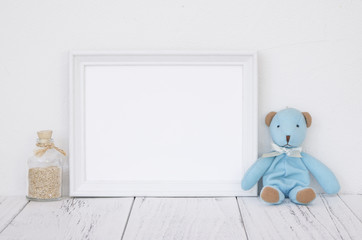 Stock photography white frame vintage painted wood table cute blue bear glass bottle with sand inside