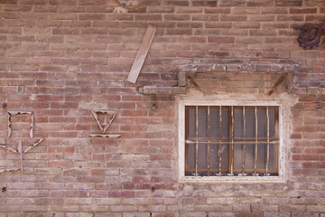 Old vintage house red brick wall and rustic window