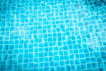 pool with blue ceramic tiles and water ripple effect