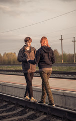 Red haired couple on the rails