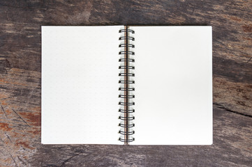 Open blank note book on grunge wood