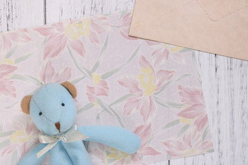 Flat lay stock photography flower pattern message letter paper cute blue bear doll