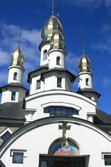 Fototapeta na wymiar Church in the Ukrainian village. Buki, Kiev region, Ukraine.Orthodox church built in a modern style.