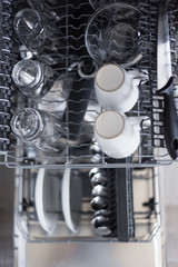 top view of utensils in dishwasher after cleaning process