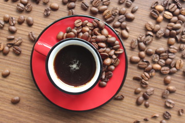 espresso and coffee beans on wooden background