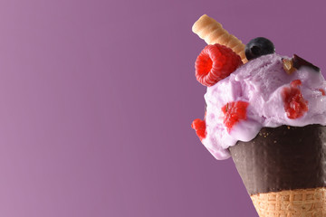 Ice cream cone flavored berries lilac background