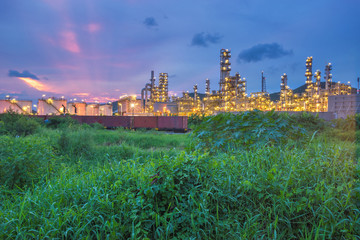 The beautiful scenery of the oil refinery at the dusk. An oil refinery or petroleum refinery is an industrial process plant where crude oil is processed and refined into more useful products.