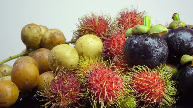 Dolly shot of fresh fruit on white background

