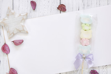 Stock Photography flat lay vintage white painted wood table note book paper flower petals cotton candy star craft