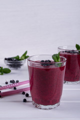 Blueberry smoothie with berries and mint leaf. Healthy vegetarian food