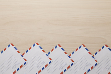 Air mail envelope on the wooden table