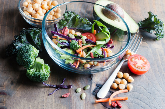 Chickpea and veggies salad, kale, broccoli, goji berries, healthy homemade vegan food, vegetarian diet, vitamin snack