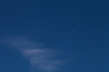 Airplane on a blue sky. Selective focus