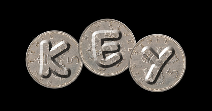KEY – Coins on black background