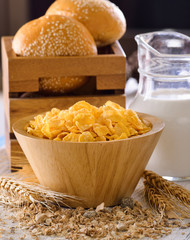 corn flakes in wood bowl