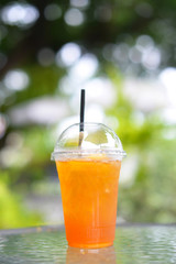Refreshing peach, ice tea served outdoors