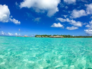 Fototapeta na wymiar Overwater bungalows of a luxury resort at Tahaa, Tahiti, French Polynesia
