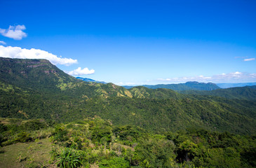 Mountain scenery, clouds, meadow with bright air.