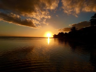Beautiful sunset at the beach of Atimaono, Tahiti, French Polynesia