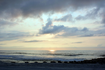 Fototapeta na wymiar Magical Summer Seashore Sunrise Over the Pier
