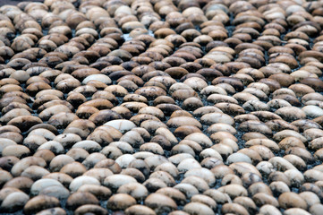 Pebbles stone pattern on the floor for foot massage.