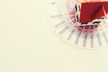 Fototapeta premium close up of home or house model and money