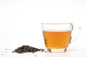 tea cup and tea leaves on white background
