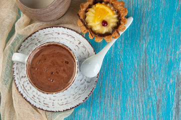 Cup of coffee on blue background