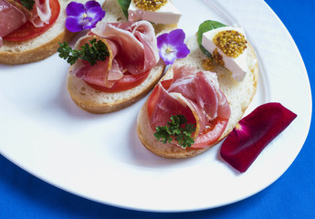 Bruschetta with prosciutto  and soft cheese