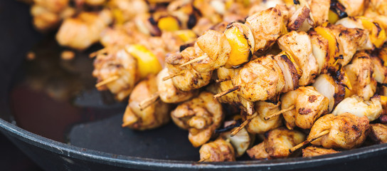 Roasted chicken kebab at seasonal fair.
