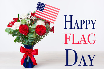 Obraz premium Beautiful bouquet with american flag on white background, Happy flag day concept