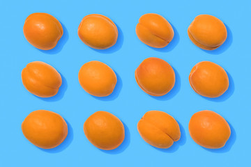 Apricots on blue background