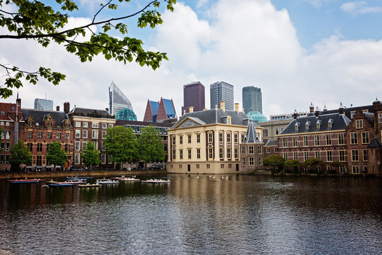 Binnenhof parliament and  Mauritshuis museum with modern skyscrapers and Hofvijver lake,  the Hague, Den Haag, Netherlands