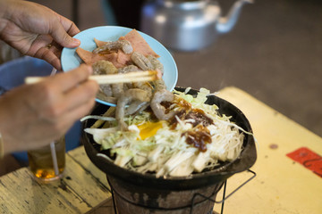 meat and pork buffet with other food vegetable seafood. fried or grilled what ever you like. mixed it together with spicy sauce. local food in thailand.