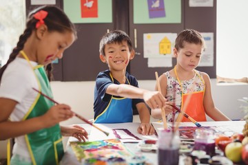 Schoolkids practicing drawing 
