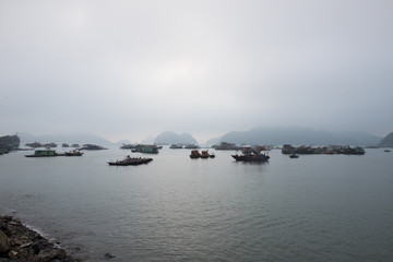 Fototapeta na wymiar Boats in the harbor on Cat Ba Island, Hai Phong Province, Vietnam
