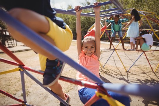 Portrait of happy girl playing in playground