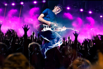 Stage lights.Abstract musical background.Playing guitar and concert concept.