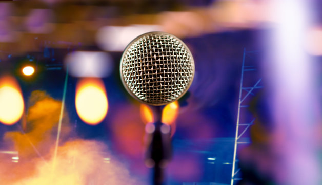 Microphone and stage lights.Concert and music concept.Live music background.Microphone and stage lights