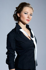 young attractive female model in black shirt and white tie