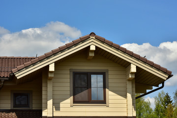 Part of the facade of a wooden house in modern style