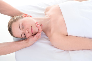 Fototapeta na wymiar Close-up of beautiful young woman receiving massage at health spa