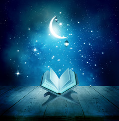 Naklejka premium Ramadan Kareem background.Quran on a wooden book stand