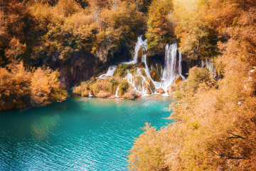 Fototapeta na wymiar Beautiful autumn forest waterfall