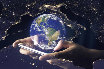 hand hold phone and connect earth net Elements of this image furnished by NASA