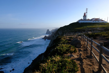 Fototapeta na wymiar Cabo da Roca lighthouse at big rocky cliffs