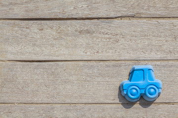 Children beach toy isolated on wood background