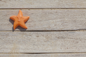 Children beach toy isolated on wood background