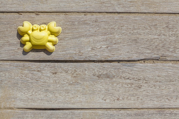 Children beach toy isolated on wood background